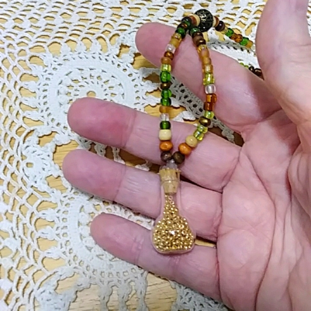 Women's Jewelry - Necklace, Earthtones with gold in bottle charm, new item